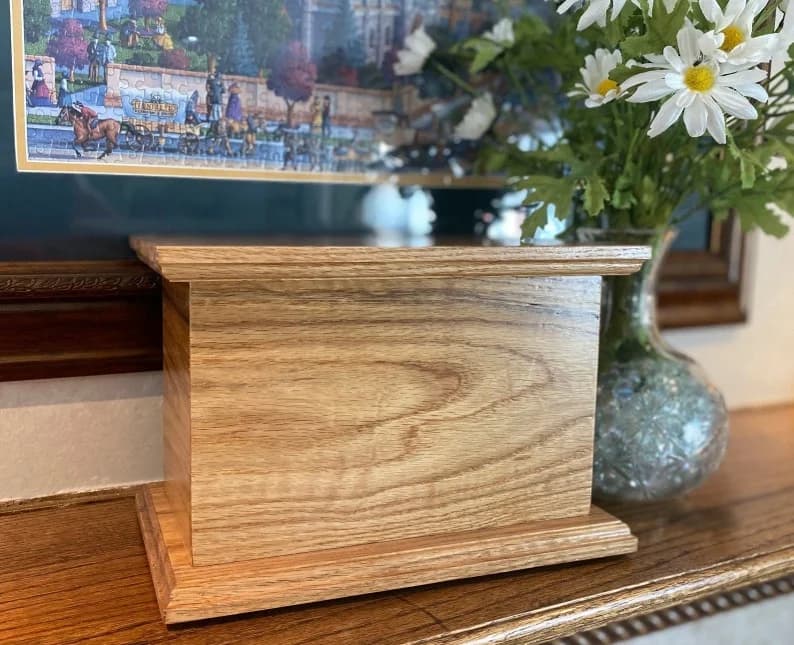 Handcrafted white oak cremation urn with natural grain visible